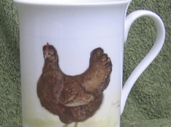 From a small range of personal mugs featuring the artists Chickens