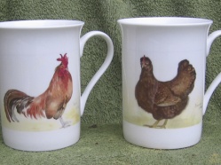 From a small range of personal mugs featuring the artists Chickens